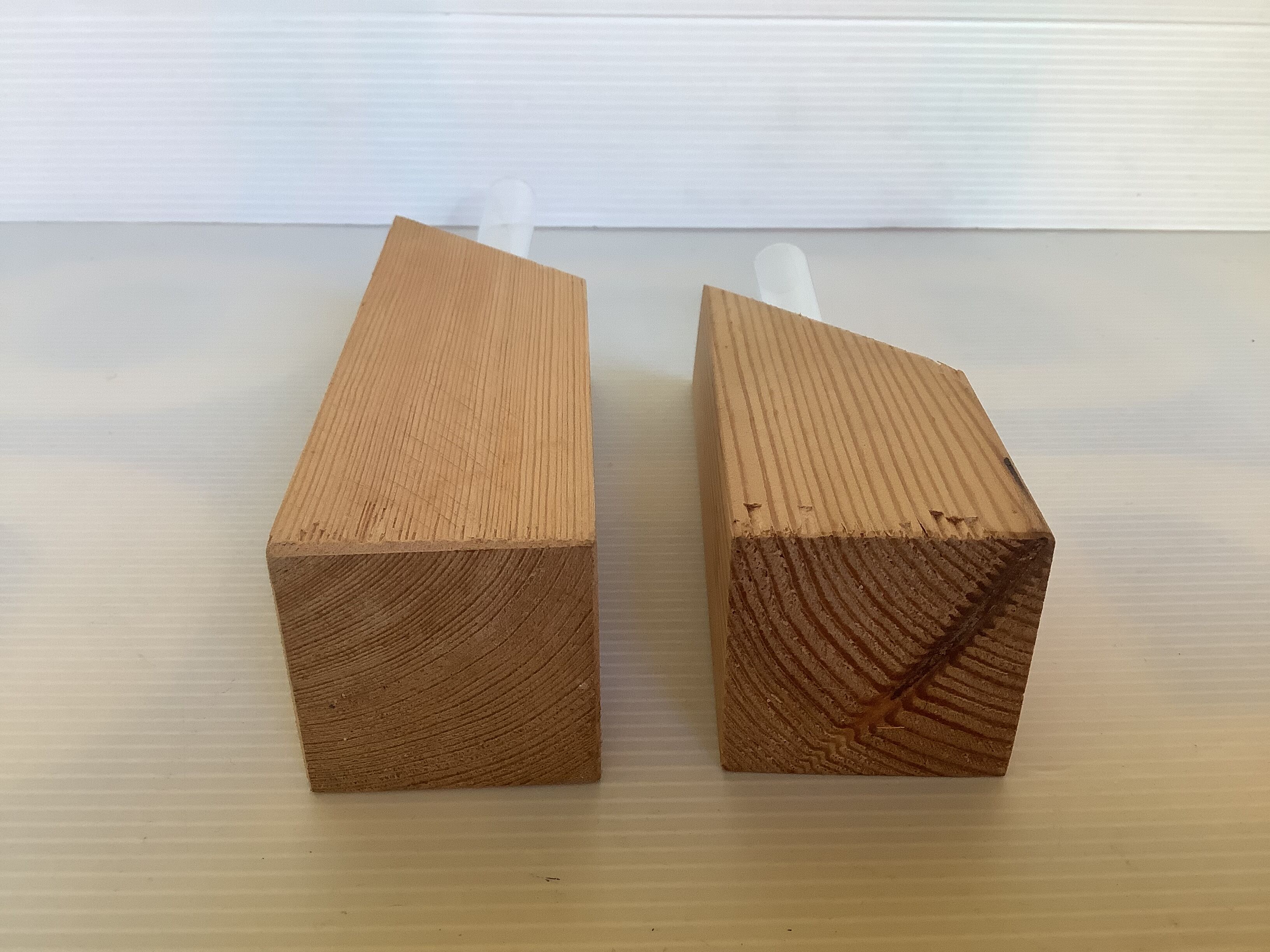 Pair of diamond-shaped wooden Scandinavian test tube vases.