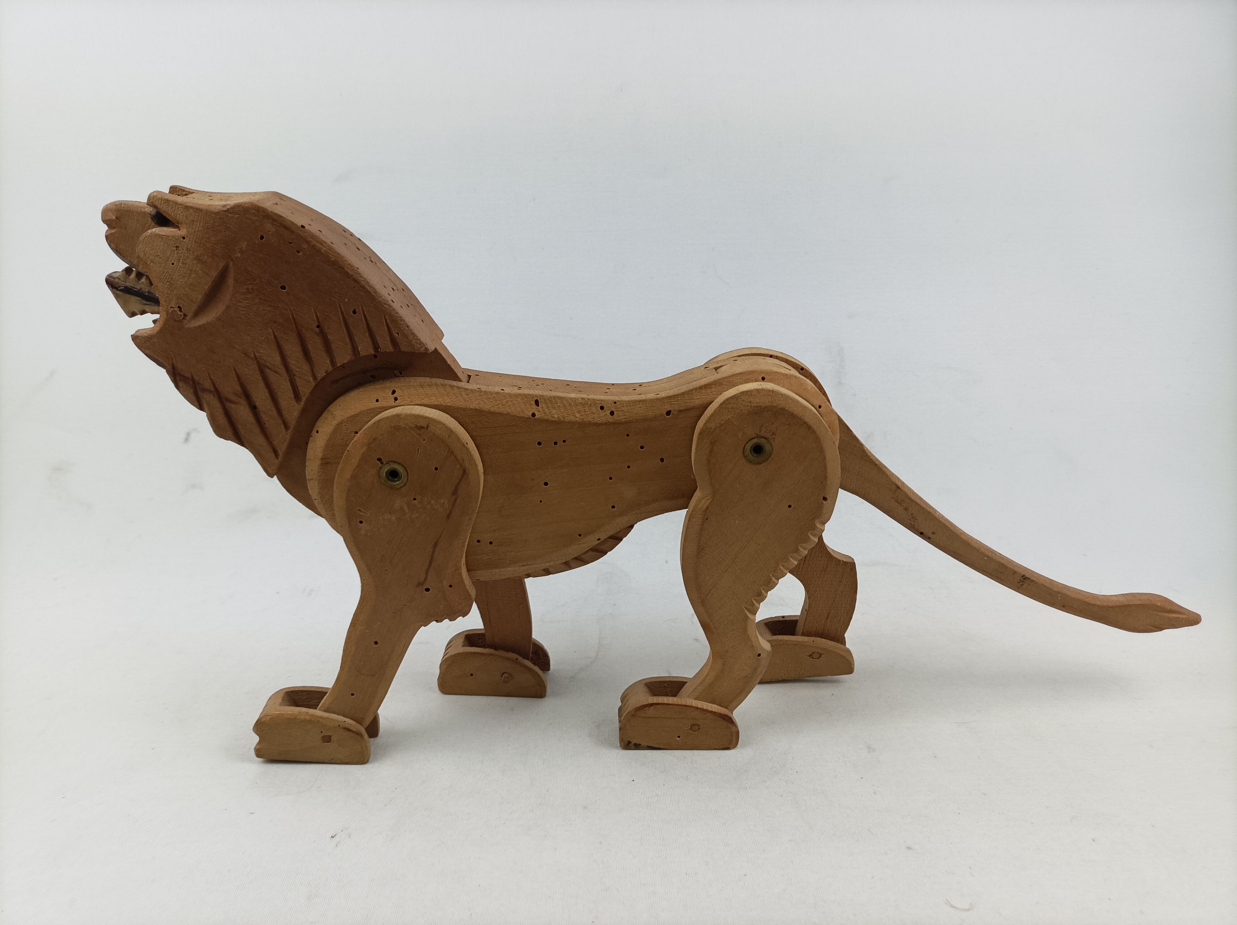 Articulated wooden lion