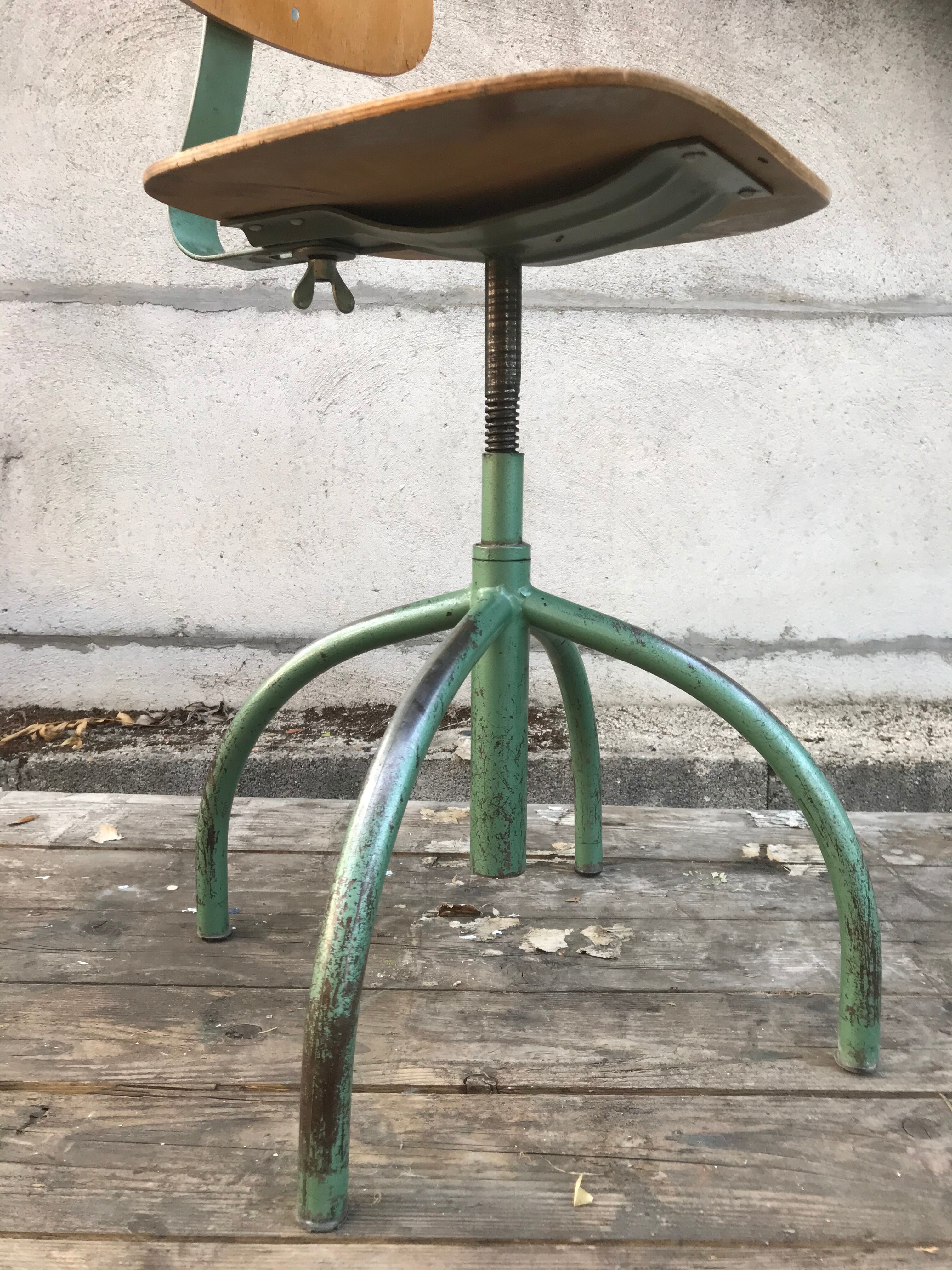 Former green metal workshop chair