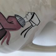 Ceramic pitcher from Quimper, created by Dominique Villard.