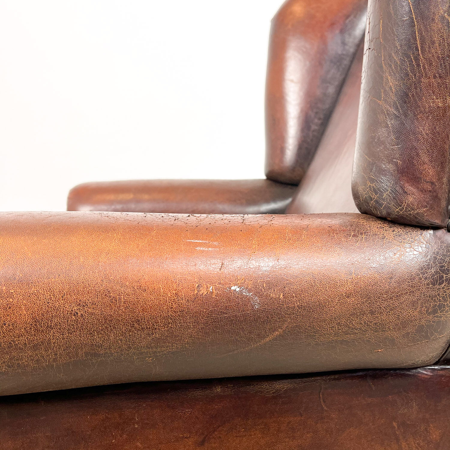 Dark brown vintage sheep leather wingback armchair
