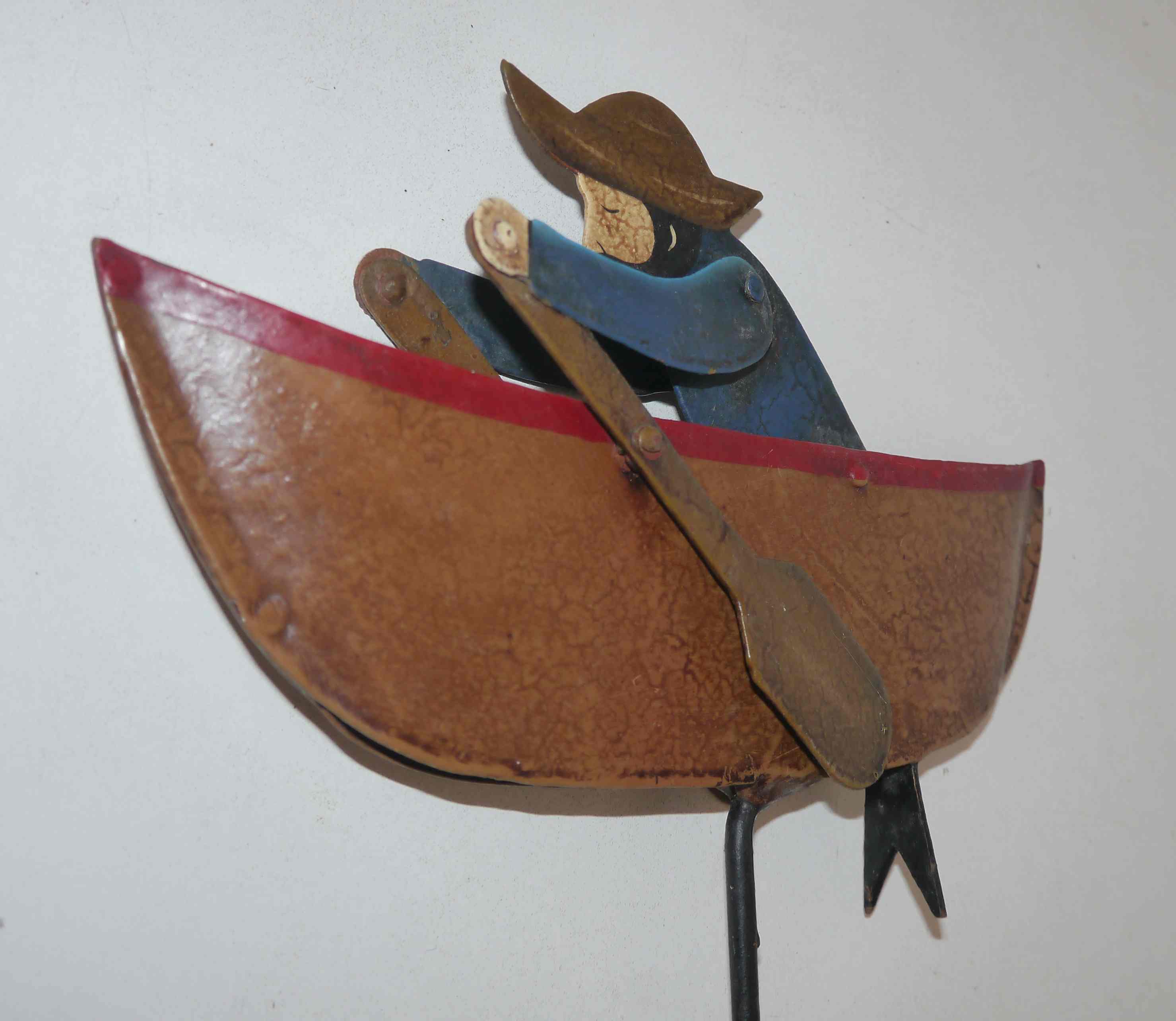 Old fishing counter balance toy in a boat