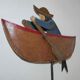 Old fishing counter balance toy in a boat