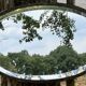 Bevelled oval mirror, richly crafted Art Deco wrought iron.