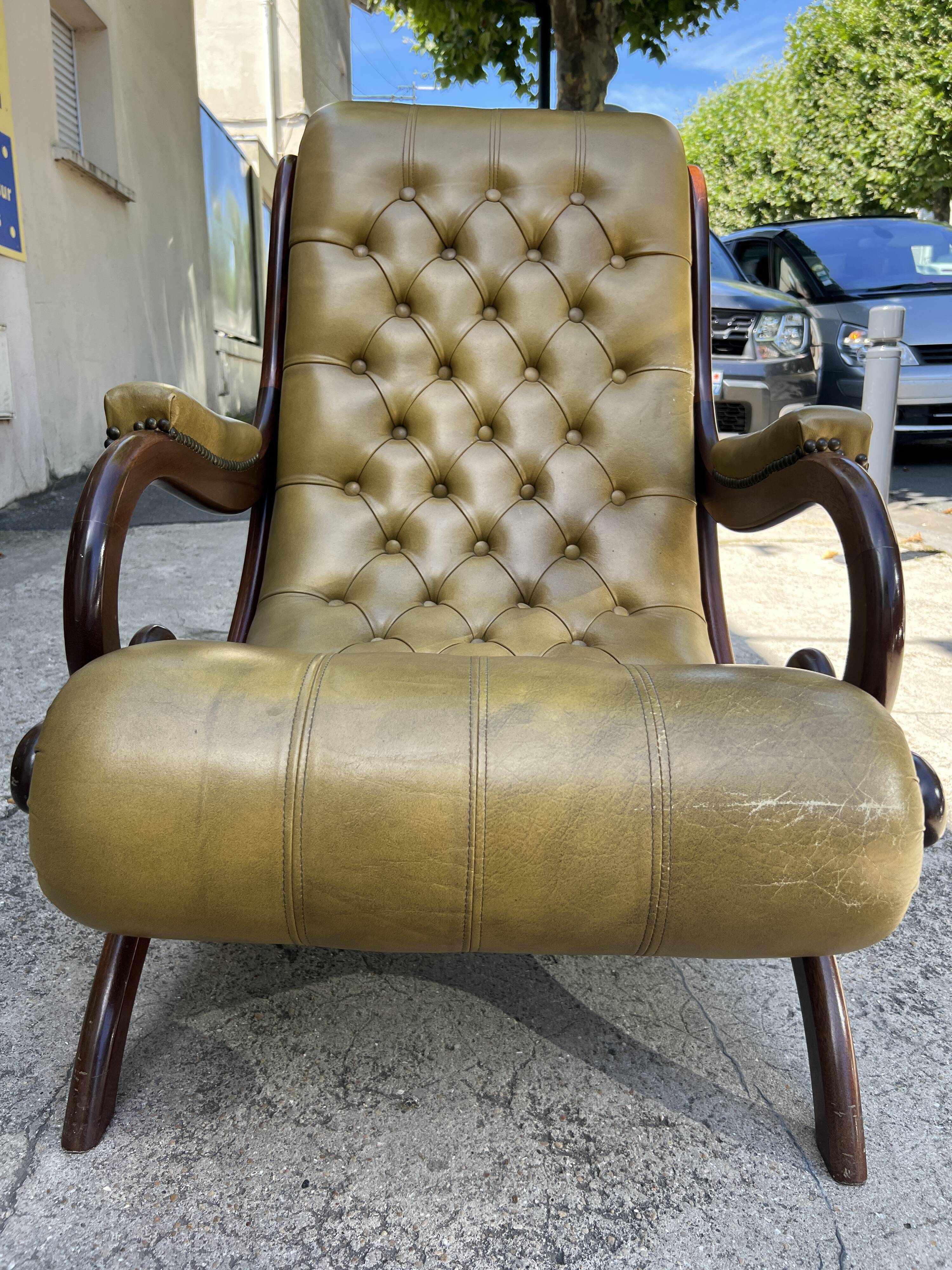 Victoria style green leather chesterfield armchair