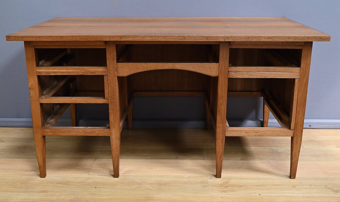 Solid oak pedestal desk, Régy establishments – 1940