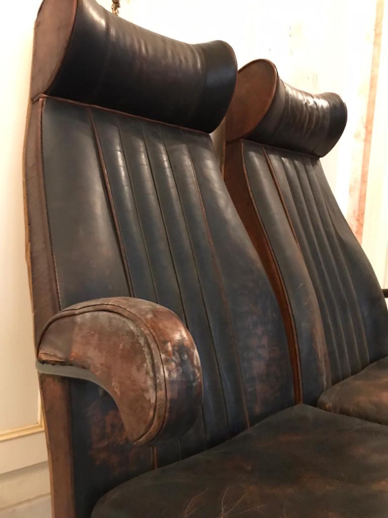 Vintage 1950s leather double-plane bus armchairs