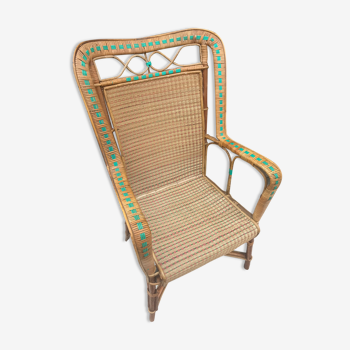 Rattan armchair with high back