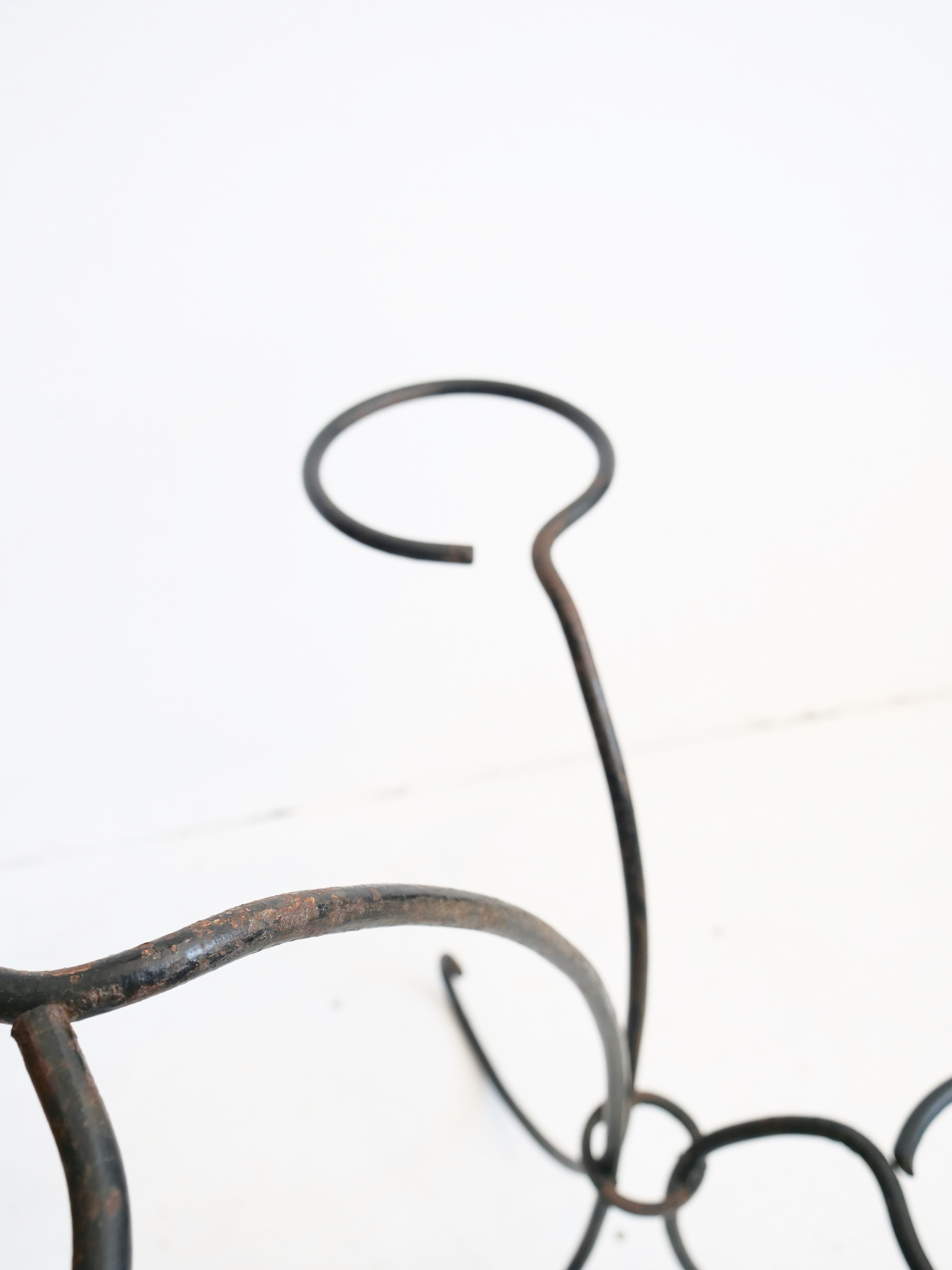 Arched steel flowered foot for balconies and terraces