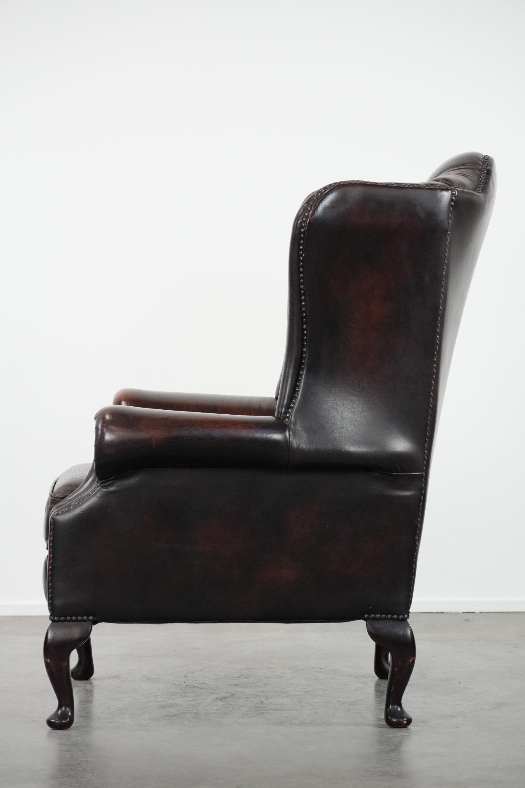 Cowhide leather Chesterfield wingback armchair in classic English style