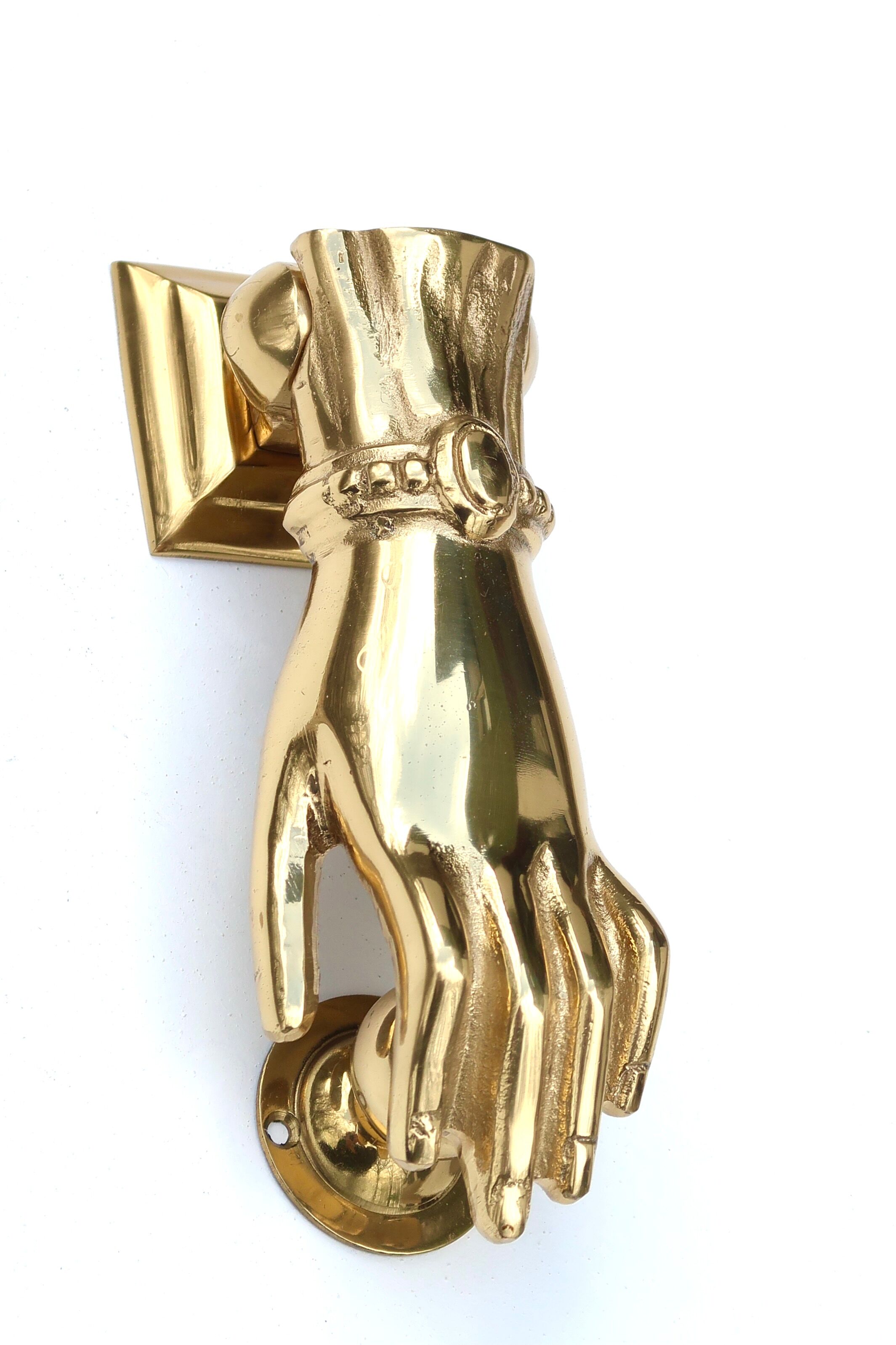 Brass hand-shaped door knocker, 1950s