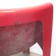 Four red fibreglass chairs from the 1970s.