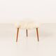 Scandinavian mid century triangular footstool in long hair sheepskin
