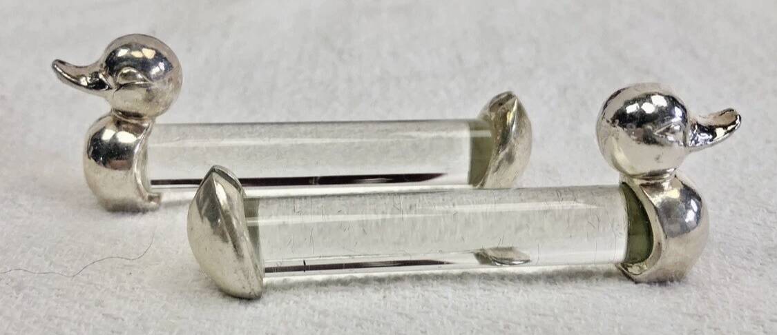 12 silver-plated metal duck knife rests with crystal.