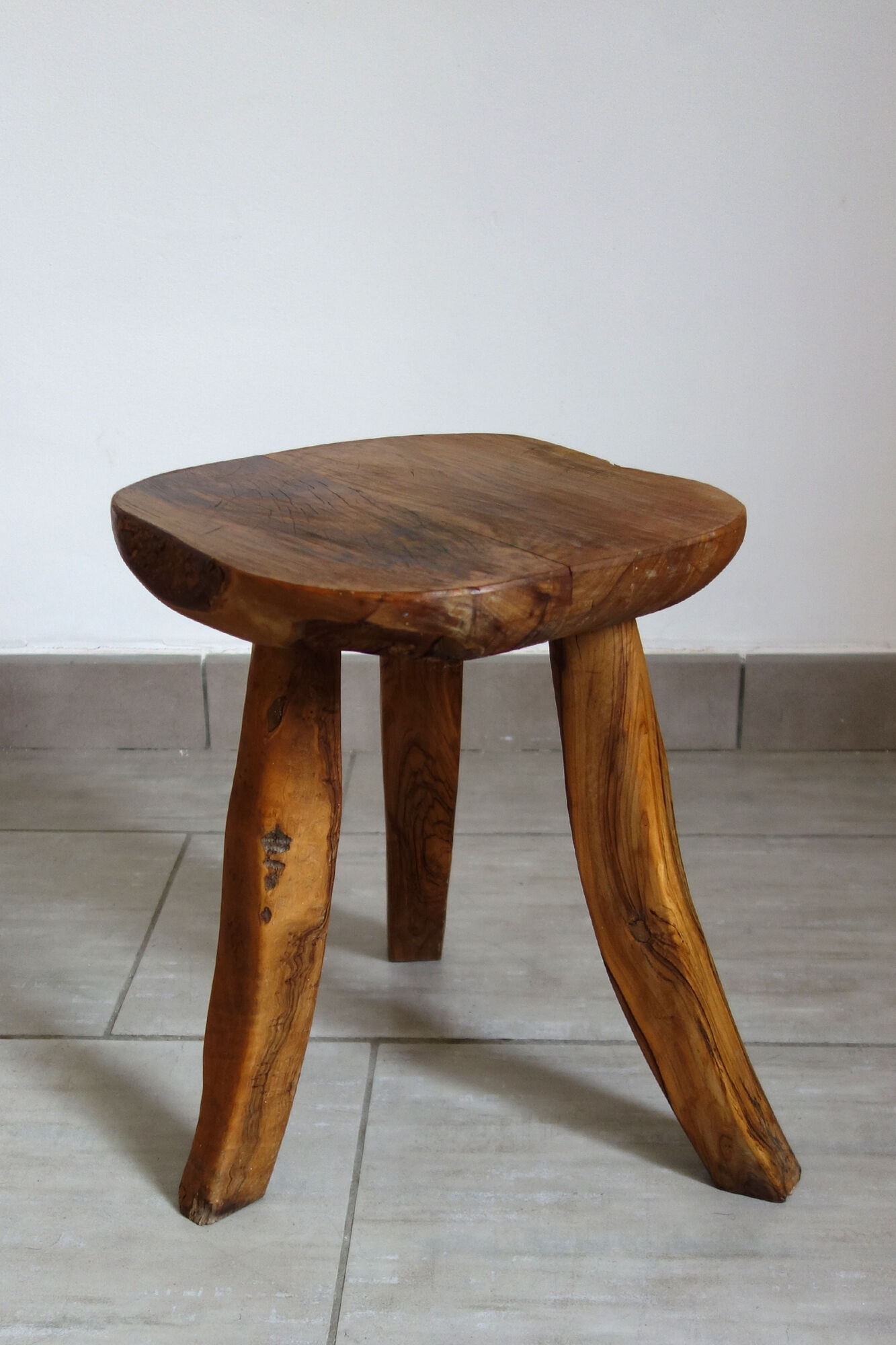 Brutalist stool made of olive wood
