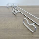 Large vintage wall-mounted coat rack in chrome metal
