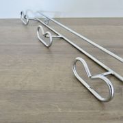 Large vintage wall-mounted coat rack in chrome metal