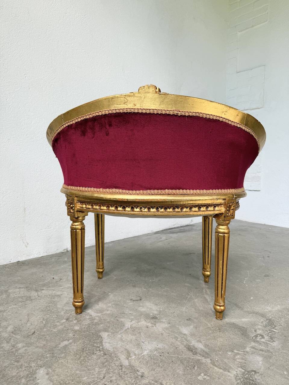 Louis XVI gilt wood and red velvet armchair