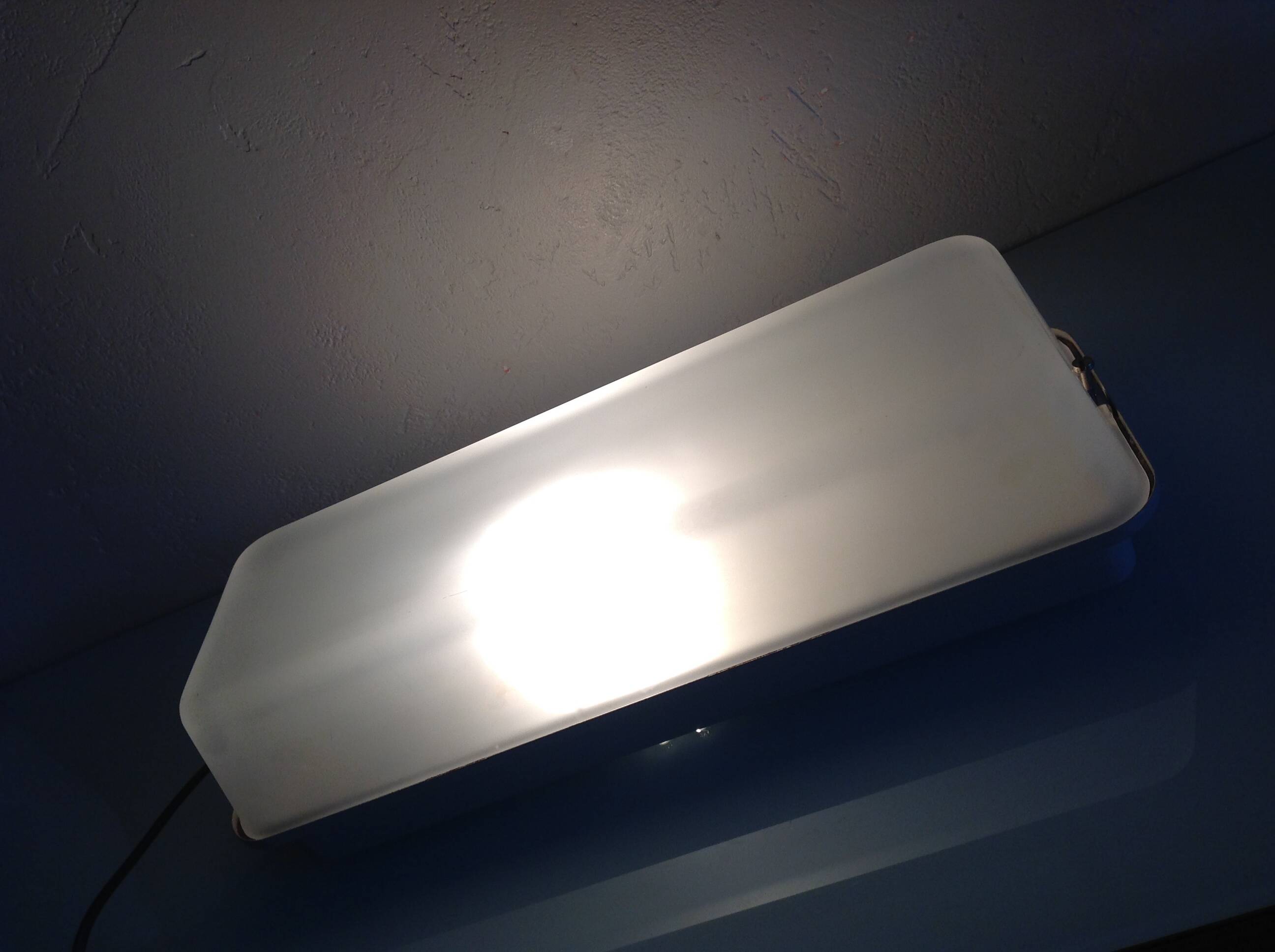 Rectangular porthole wall light in industrial/70s style frosted glass