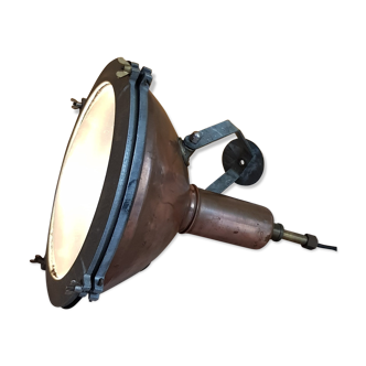 Old brass boat headlight with Holophane interior glass