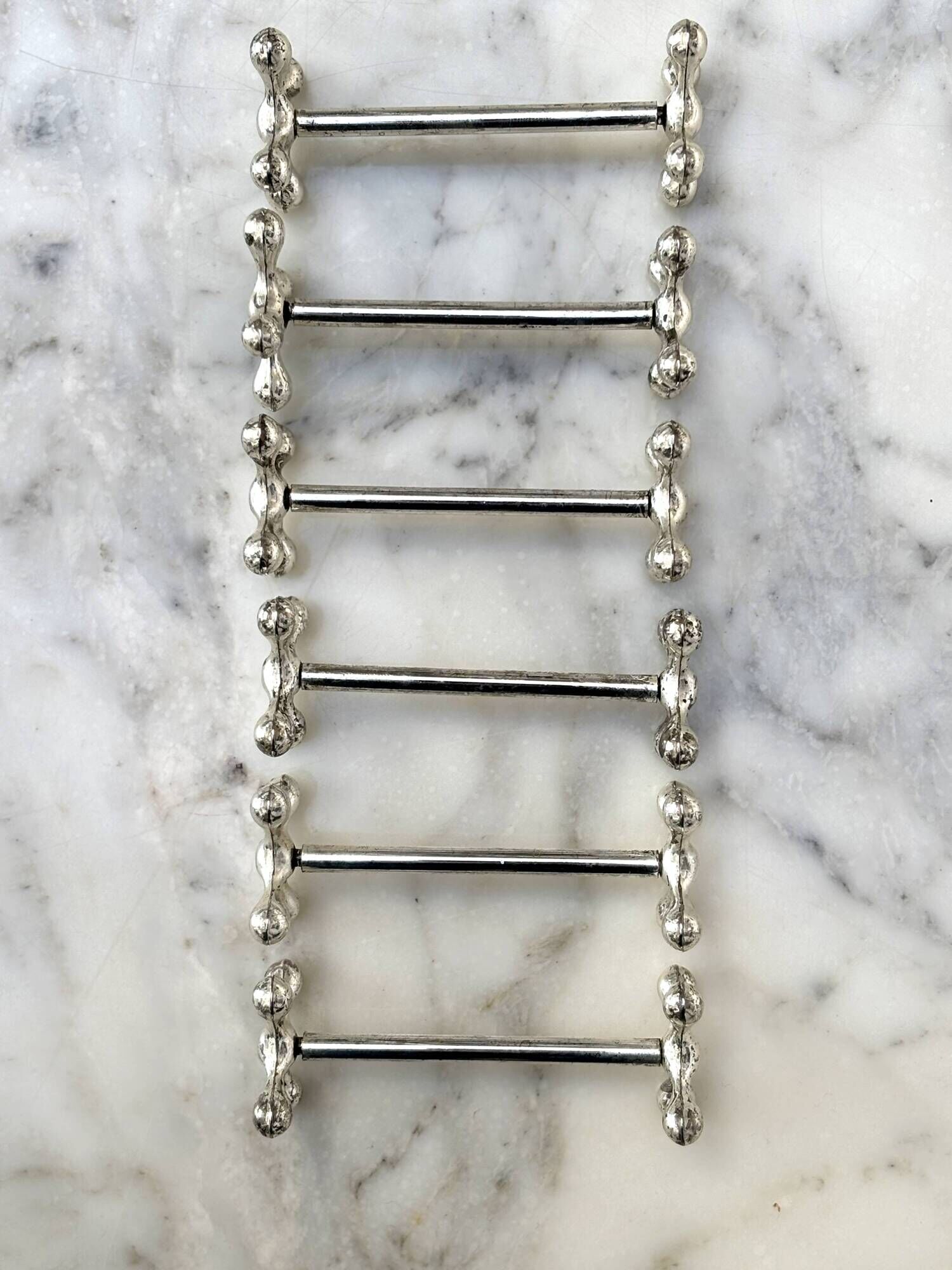 Set of 6 silver metal knife rests in the Letang Remy style