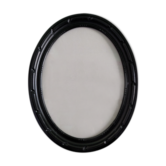 Cadre ovale en bois sculpté vernis noir