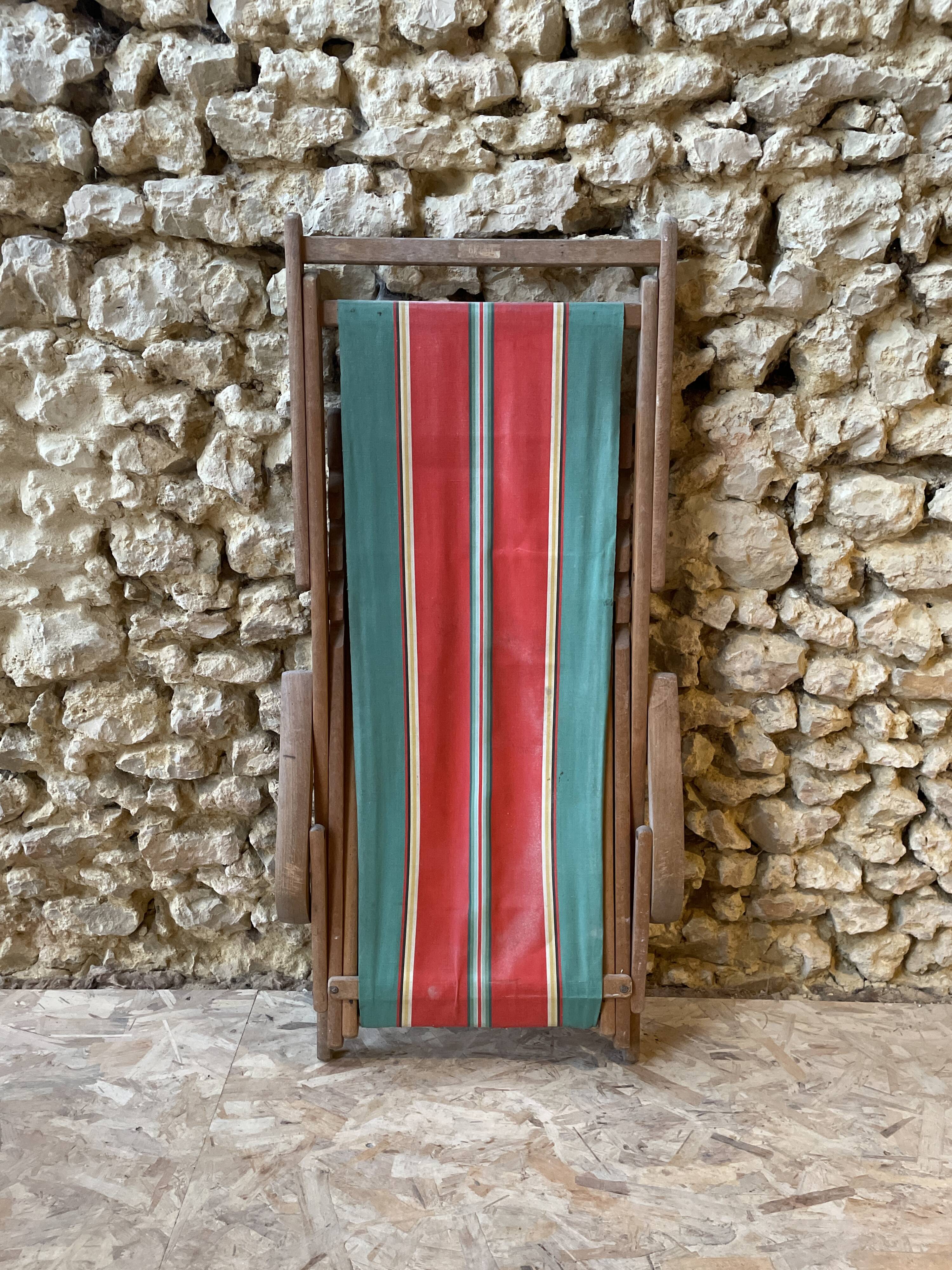 Red and green striped wooden deckchair