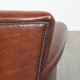 Sheep leather armchair correctly finished with decorative nails