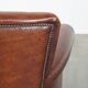 Sheep leather armchair correctly finished with decorative nails