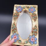 Flower-decorated sandstone mirror, circa 1970