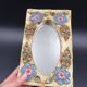 Flower-decorated sandstone mirror, circa 1970