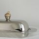 stainless steel butter dish with a golden knob