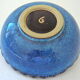 Cut or pocket in polychrome varnished sandstone with a blue and floral decoration