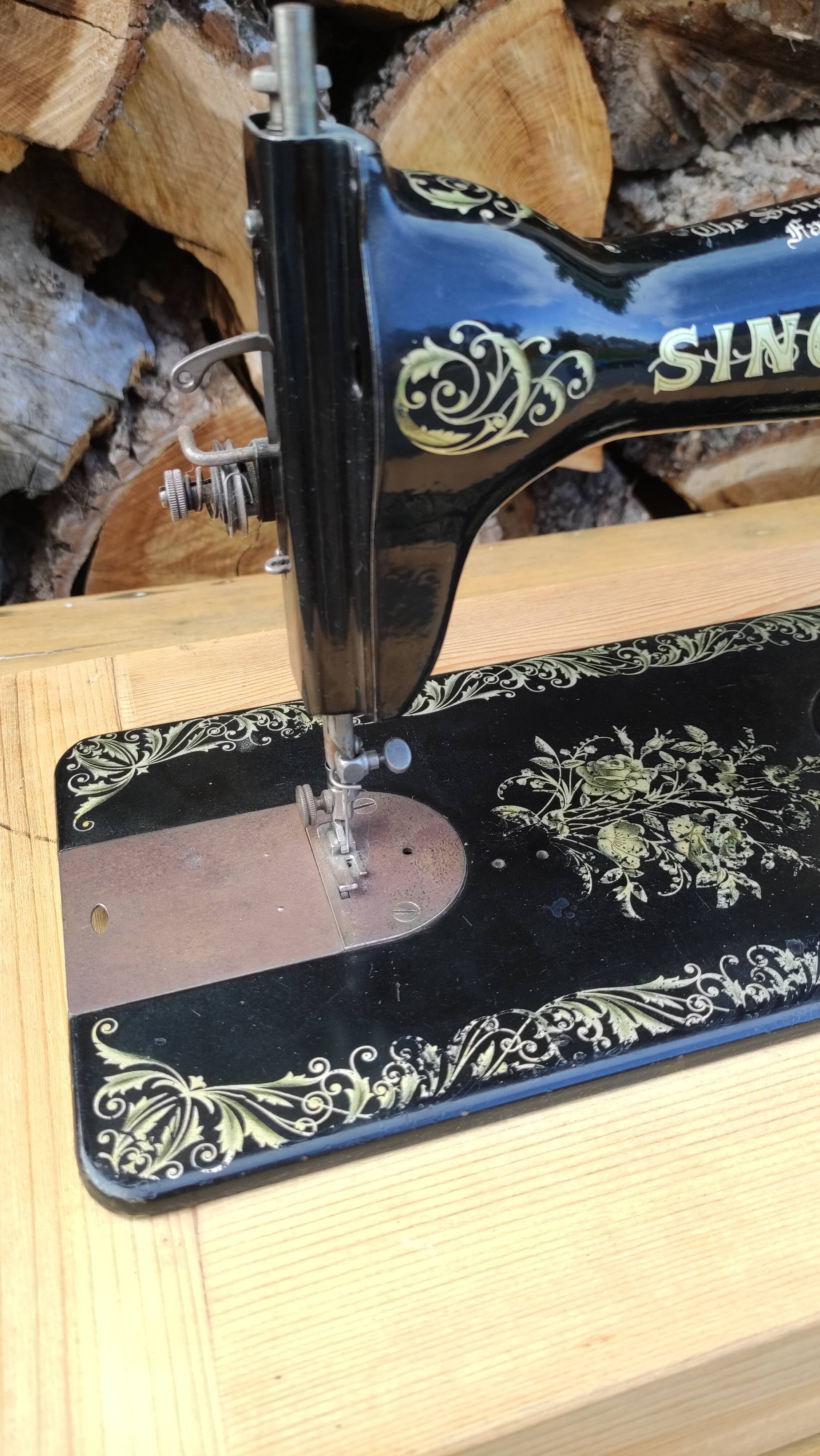 Old Singer sewing machine on pedestal