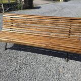 Wooden garden bench with cast iron base