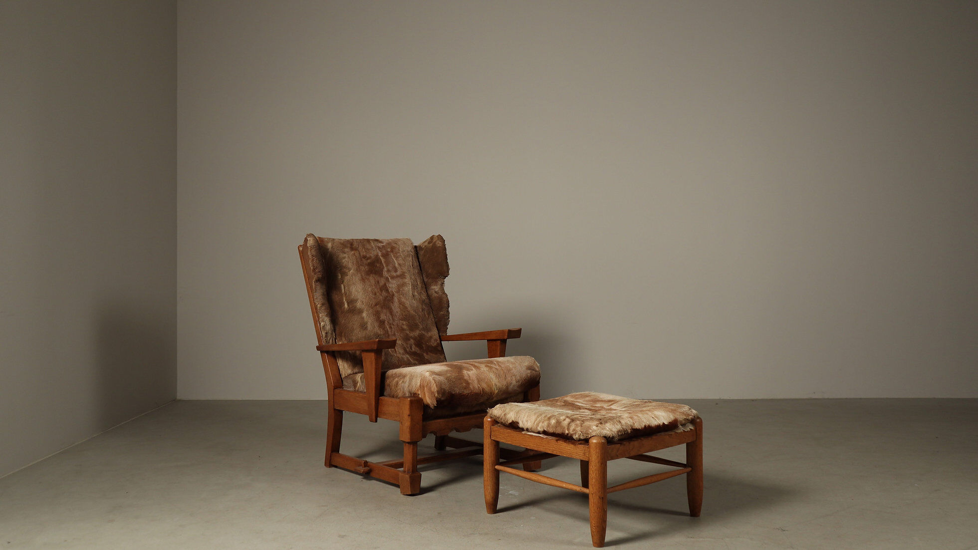 Brutalist oak lounge chair and ottoman in original goat hide, 1960s