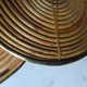 Rattan trivets attributed to Gabriella Crespi.