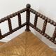 Turned wood corner chair with straw seat