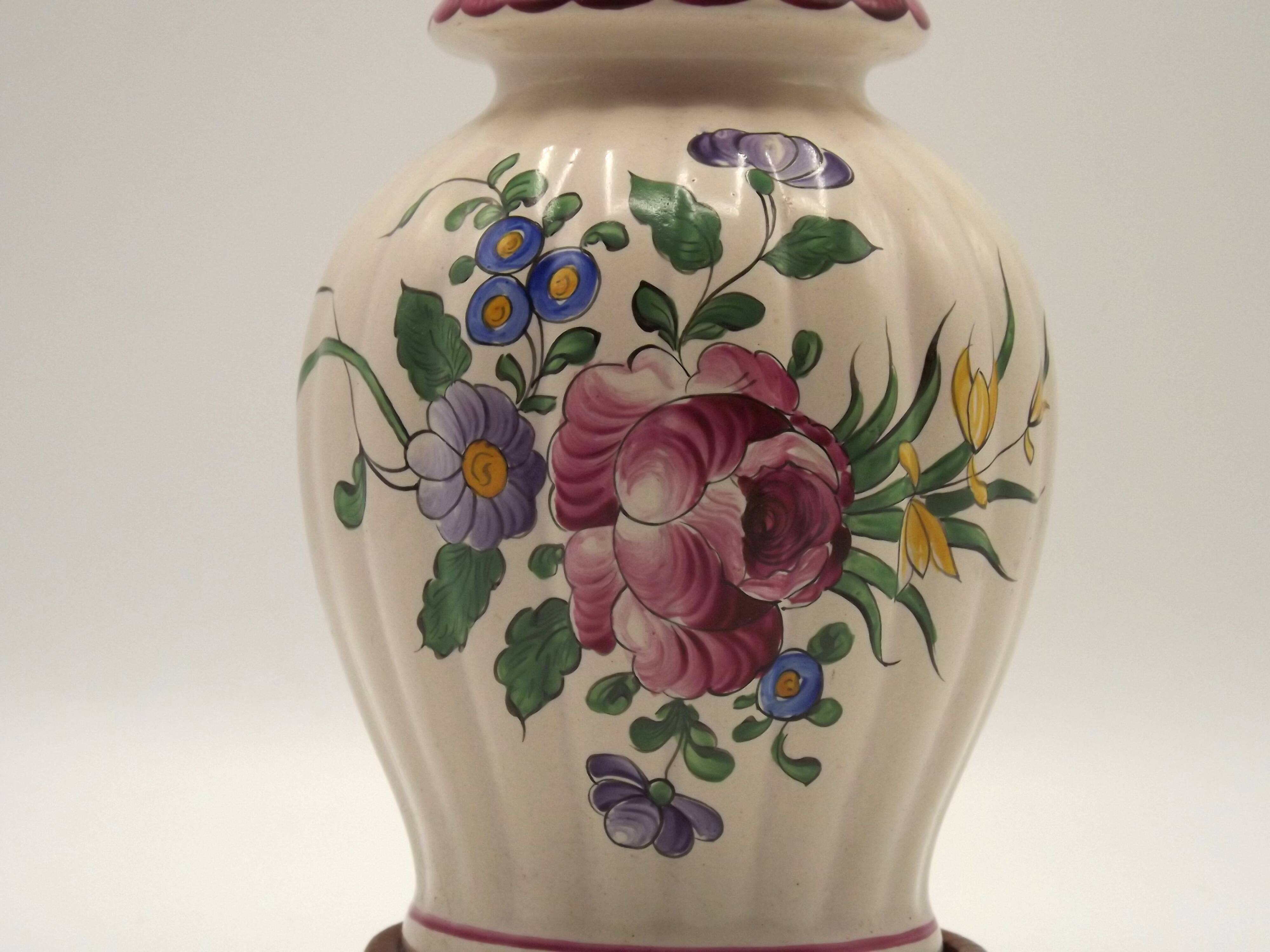 Pretty French vintage hand-painted ceramic floral lamp base on wooden plinth.