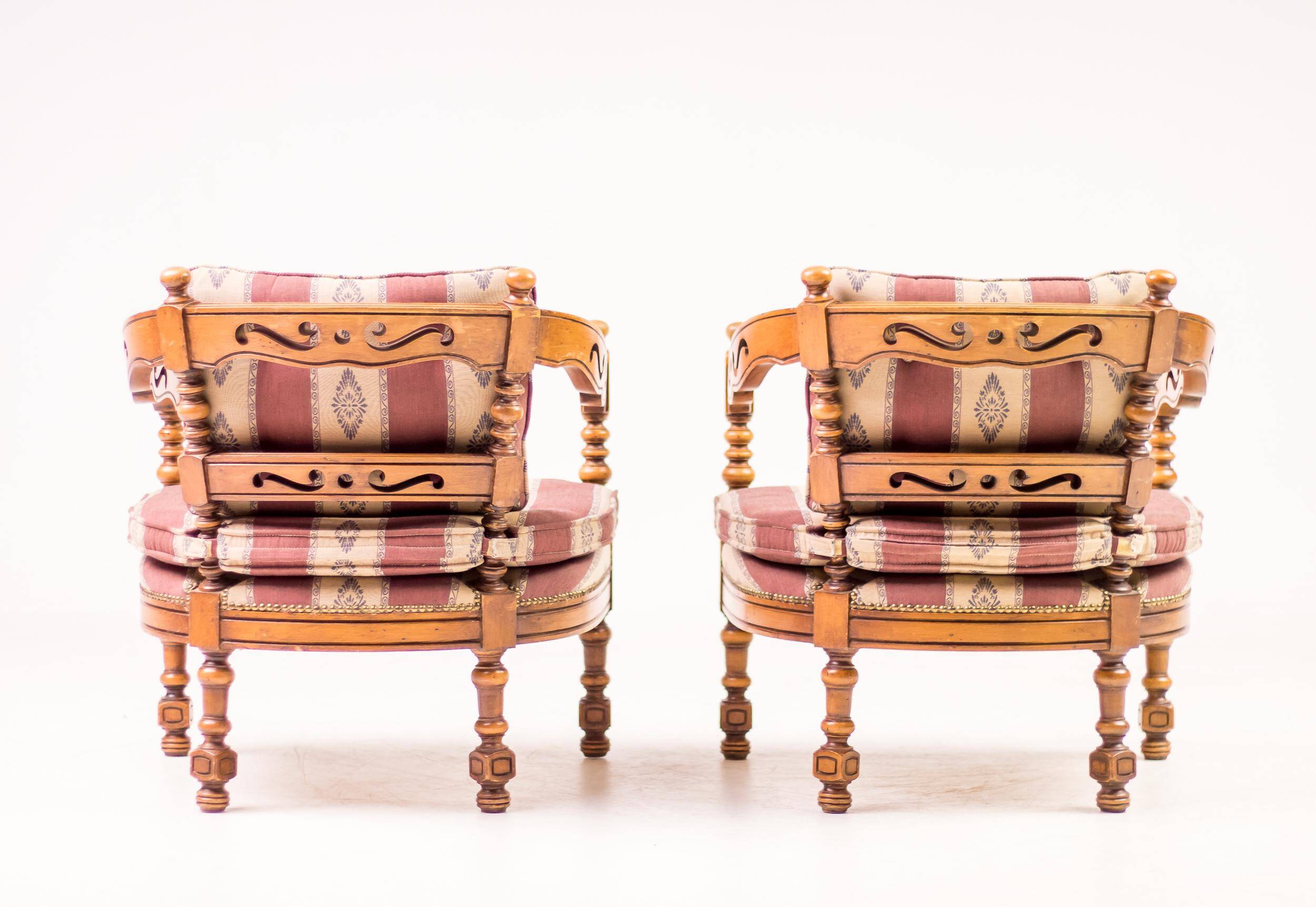 Pair of Giorgetti "1975 Gallery" armchairs in carved wood, original upholstery.