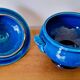 Blue ceramic soup tureen and crackled finish trivet.