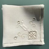 12 embroidered and opened white linen towels