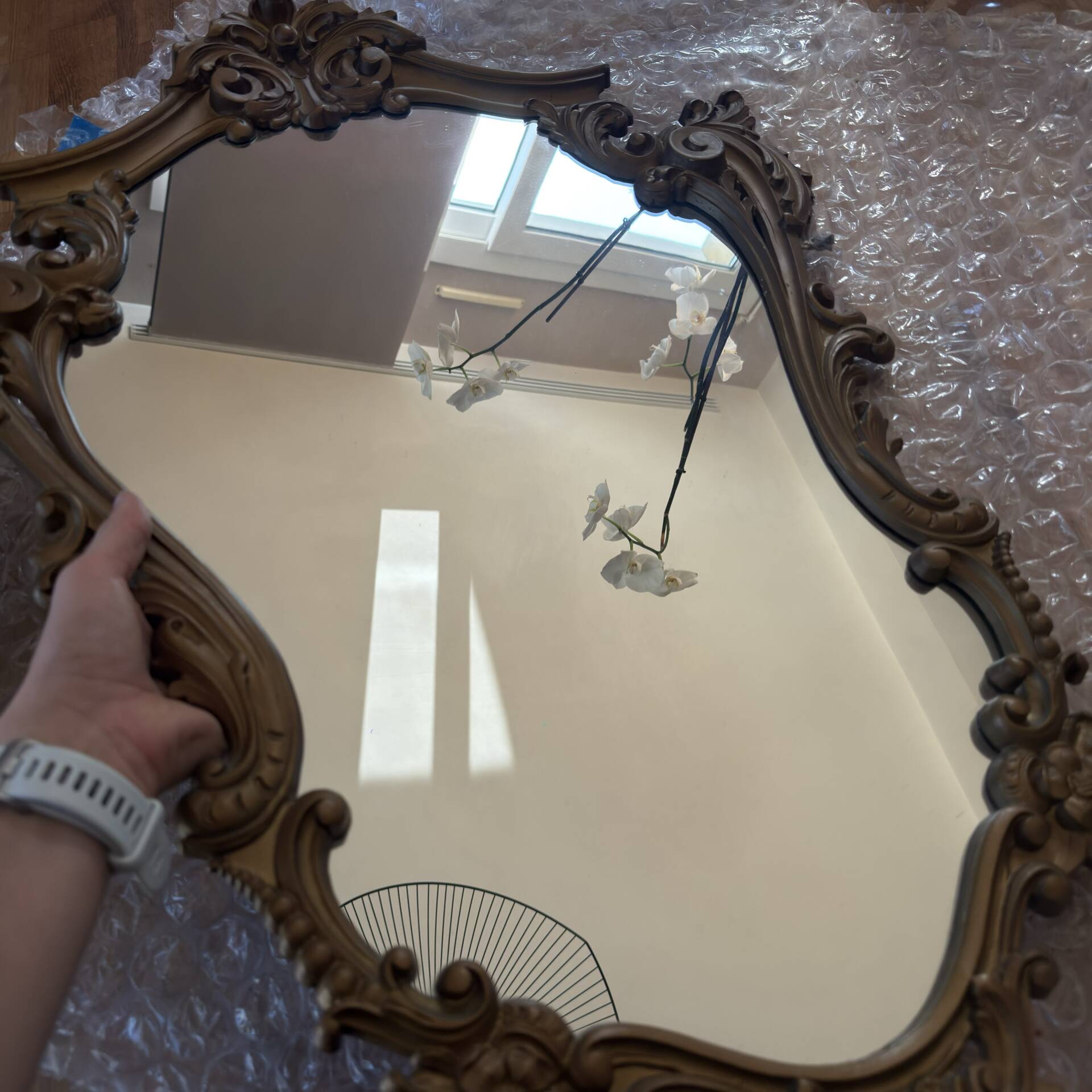 Antique mirror in Louis XV Rocaille style with carved frame.