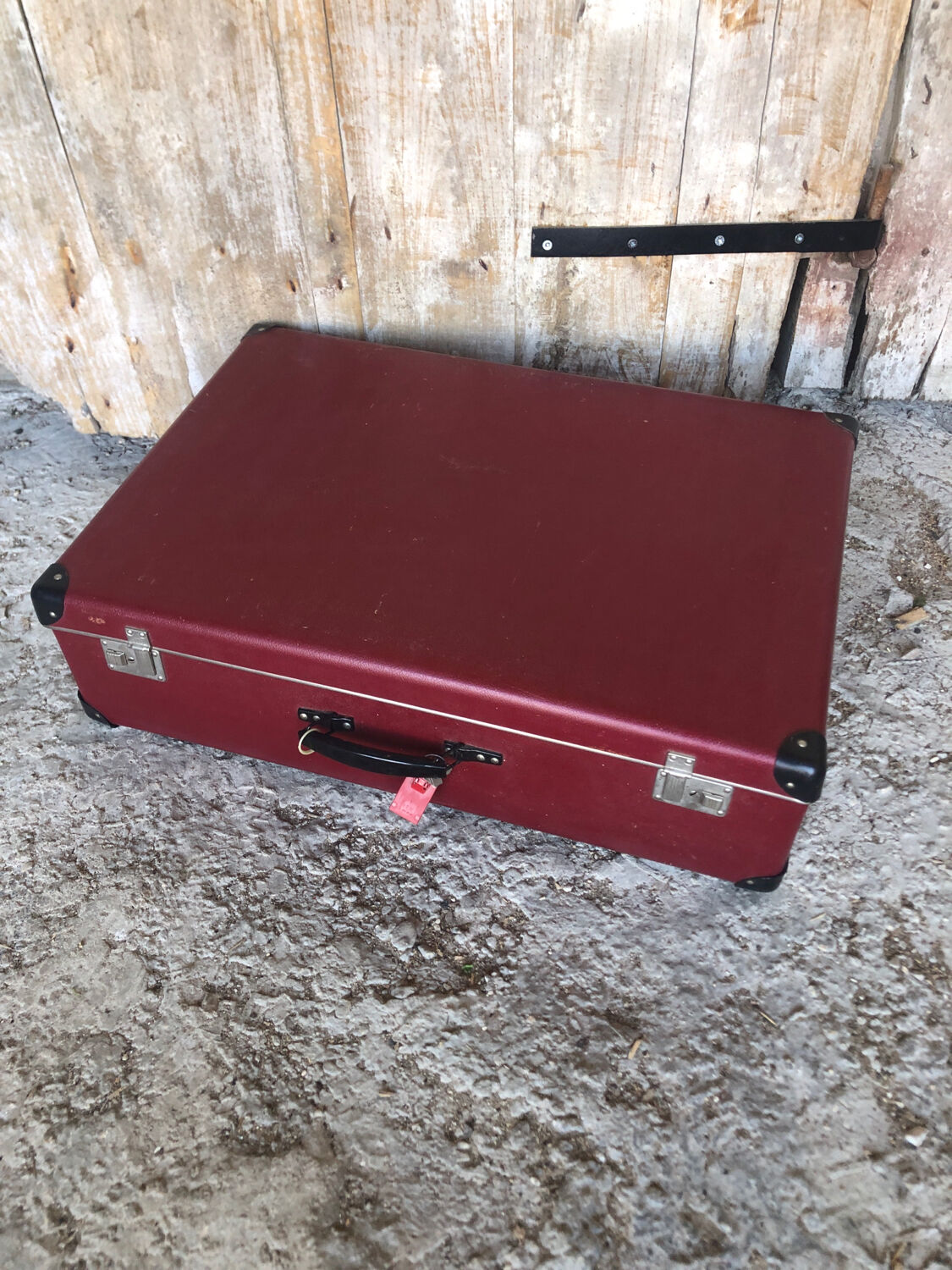 Old suitcase red cardboard bordeaux clasp metal vintage