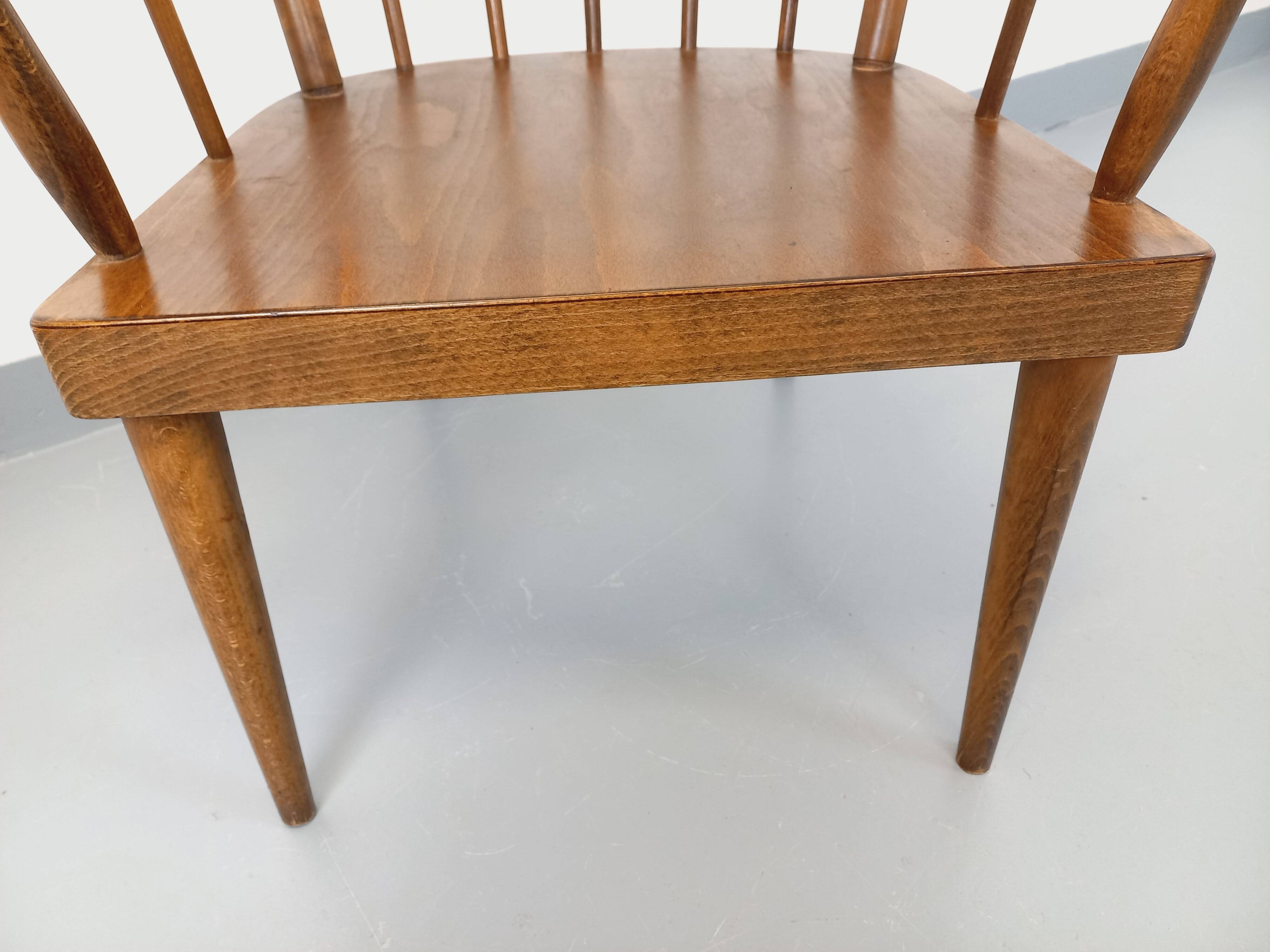 Vintage wooden armchair Baumann model Éventail from the 1960s.