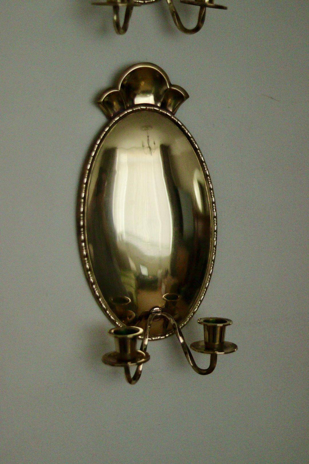 Pair of Swedish brass wall sconces from the mid-century.