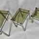 Tables in chrome metal and tinted glass. year 70