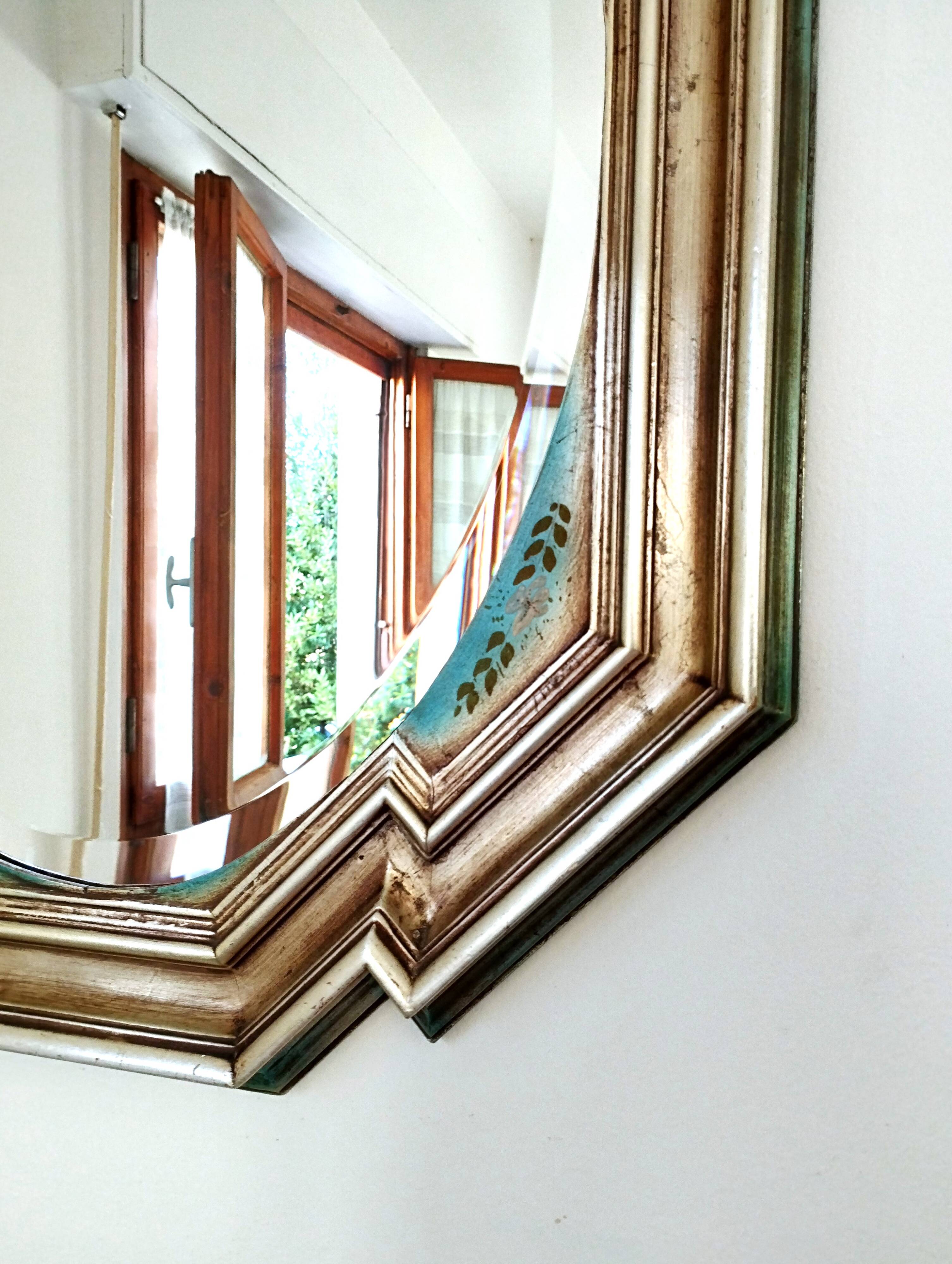 Vintage octagonal mirror, molar glass, patinated green silvering, floral decoration.