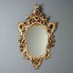 Antique lacquered and gilded wooden mirror, Italy, early 20th century.