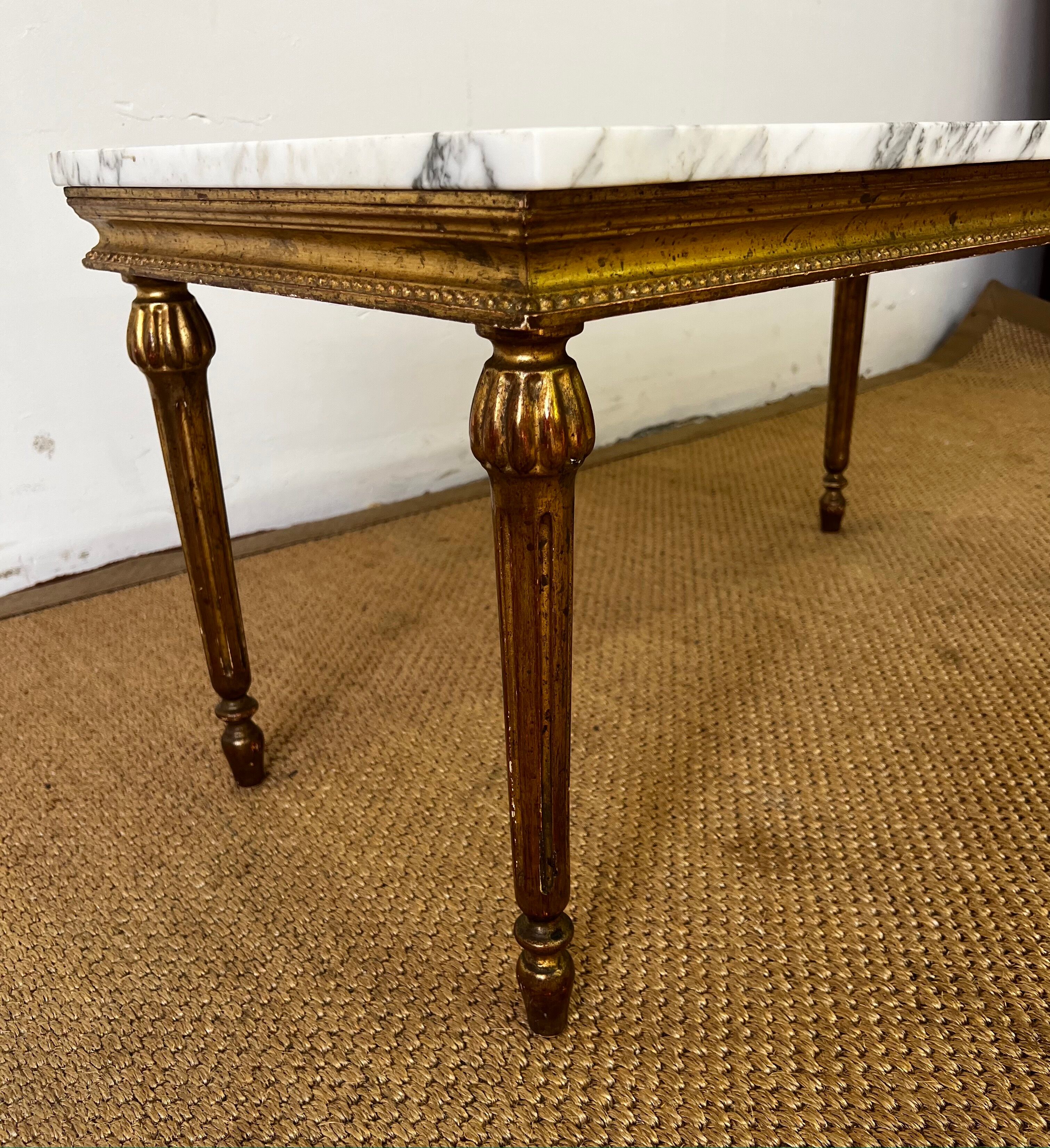 Gilded wood coffee table and marble top Louis XVI style